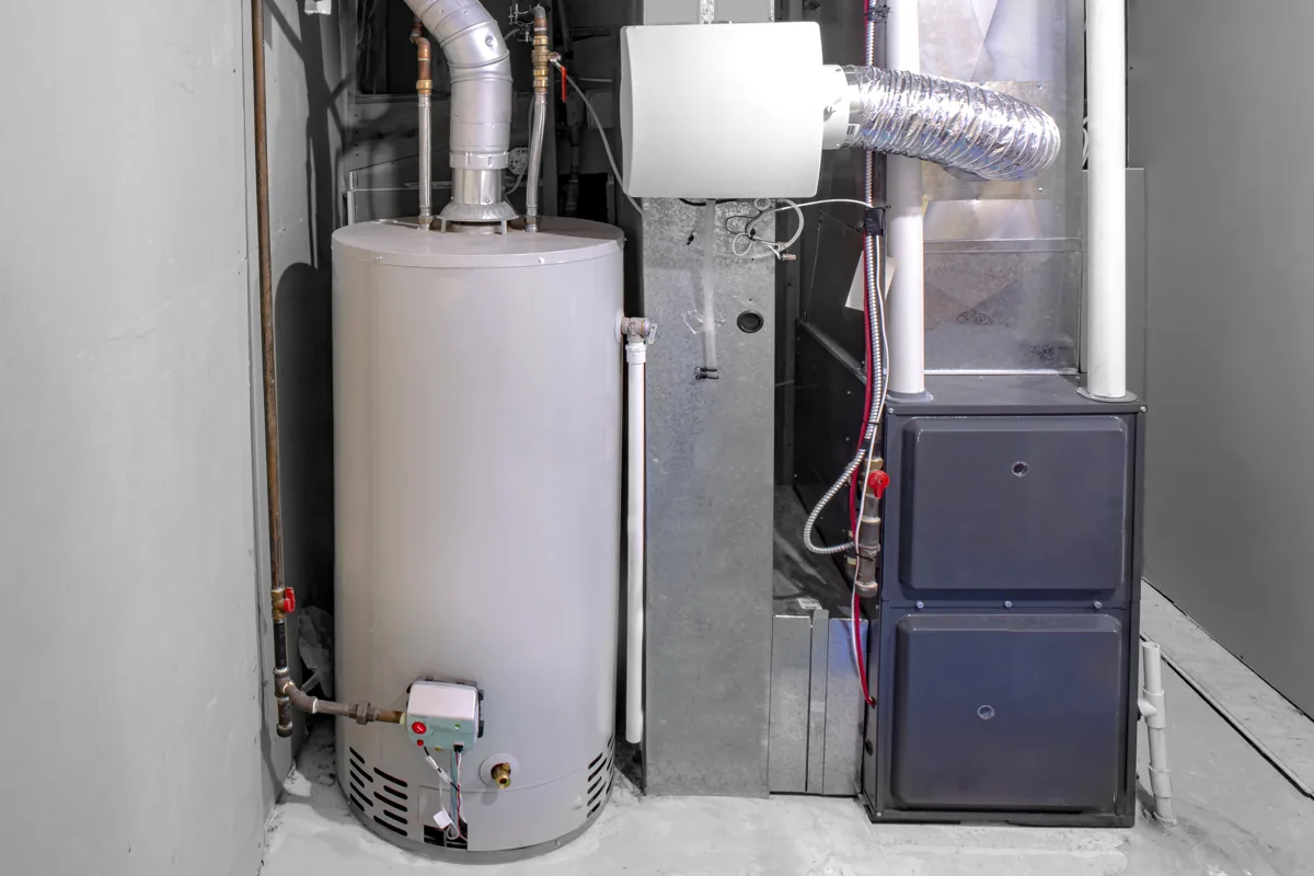 Furnace, water heater and ductwork in a home utility room