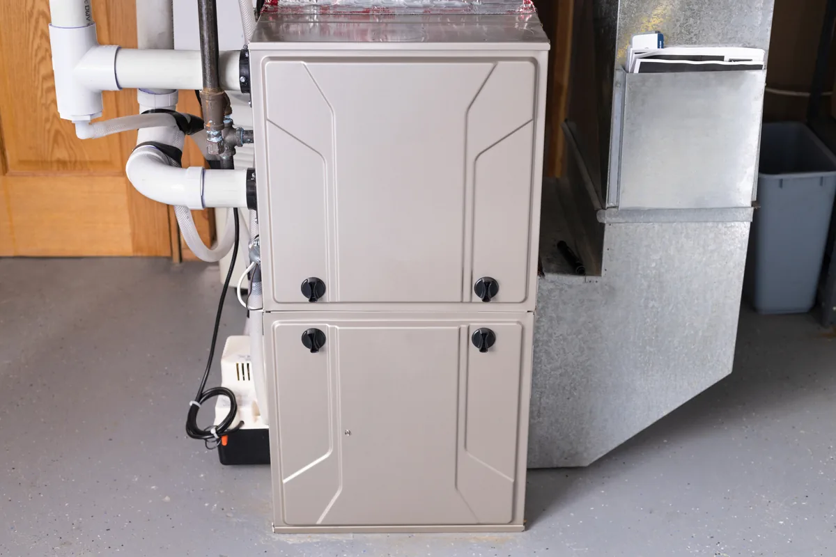 Residential furnace connected to metal ductwork in a basement